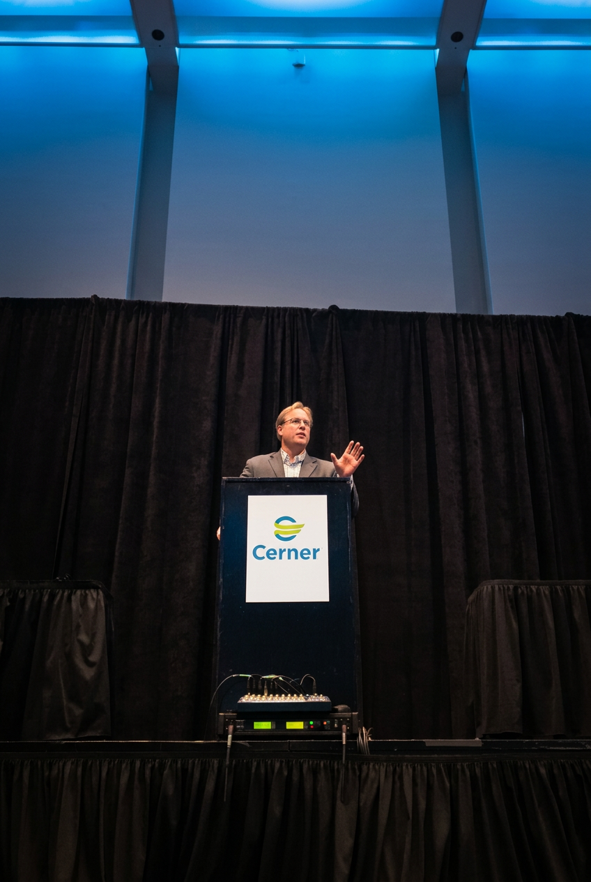 Trevor Dale presenting from a podium at an industry conference
